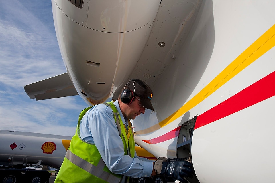 Man filling aviation fuel to plane