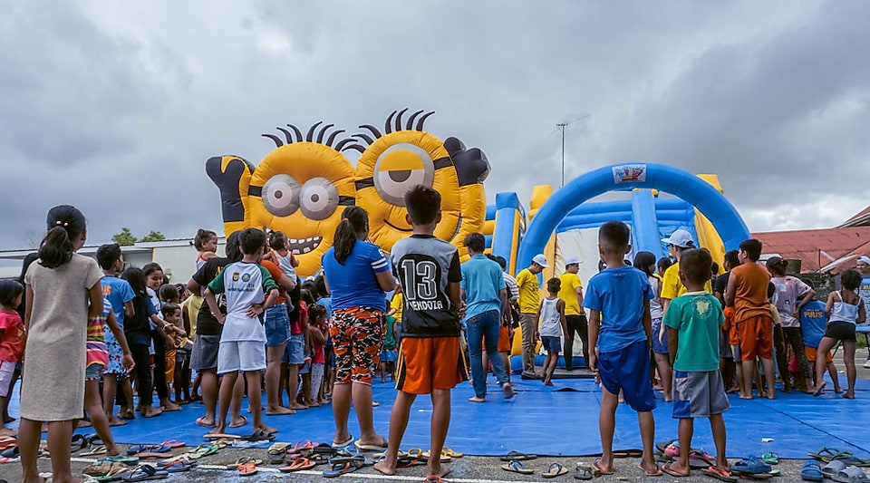 Shell's inflatable slide spares children a moment's respite from struggles of the Taal evacuation 