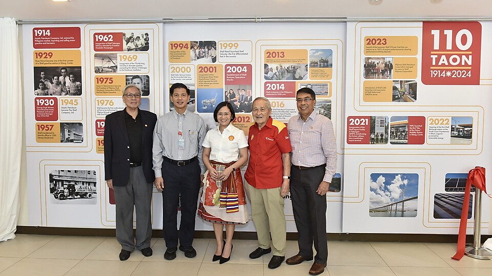 Generations of Shell leaders, united by a legacy of progress. Past and present Country Chairs (L-R) Ed Chua, Cesar Romero, Lorelie Quiambao-Osial, Cesar A. Buenaventura, and Eli Santiago pose before the milestone wall during the celebration of 110 years of Shell in the Philippines as it empowers the lives of the Filipinos.